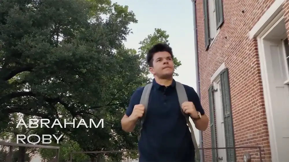 Abraham Roby walking on campus