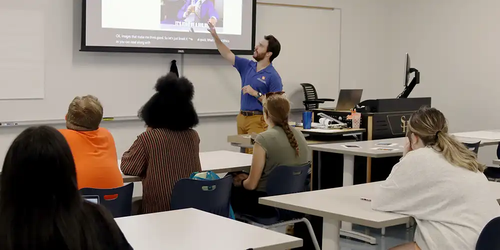 Dr. Caleb Hubbard teaches class.