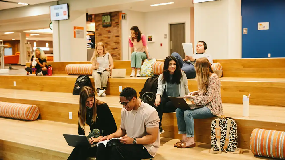 Students walking in lab area