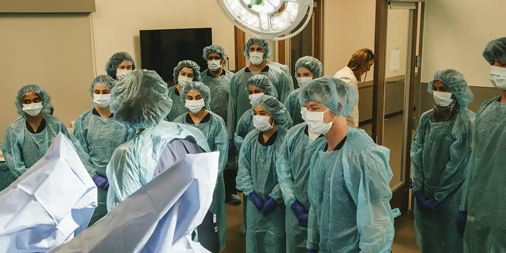 Student doctors in a birthing simulation lecture