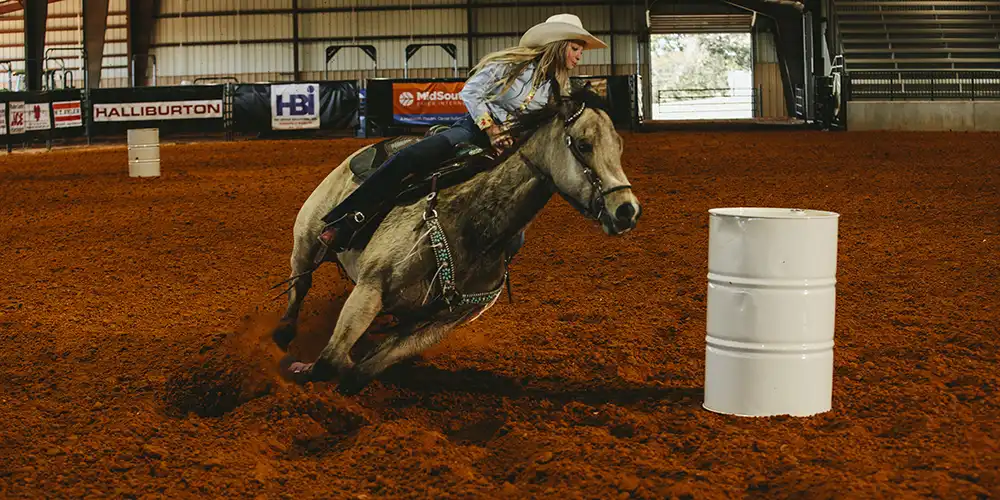 ​​SHSU Student riding at the Sonny Sikes Arena at Gibbs Ranch​.