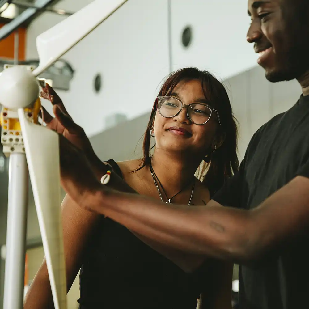 ​​SHSU Students working a mini turbine​ 