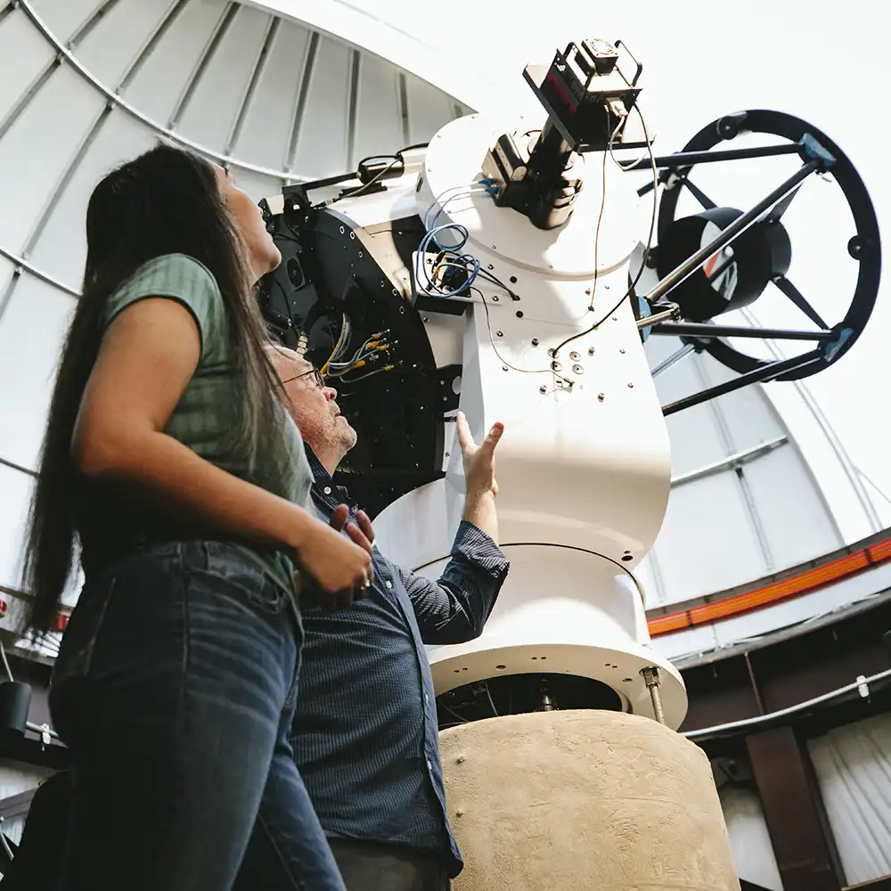 ​​SHSU Students looking at the Dominey Observatory Telescope​