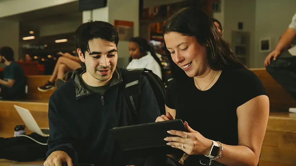 Students discussing project in the Lowman Student Center.