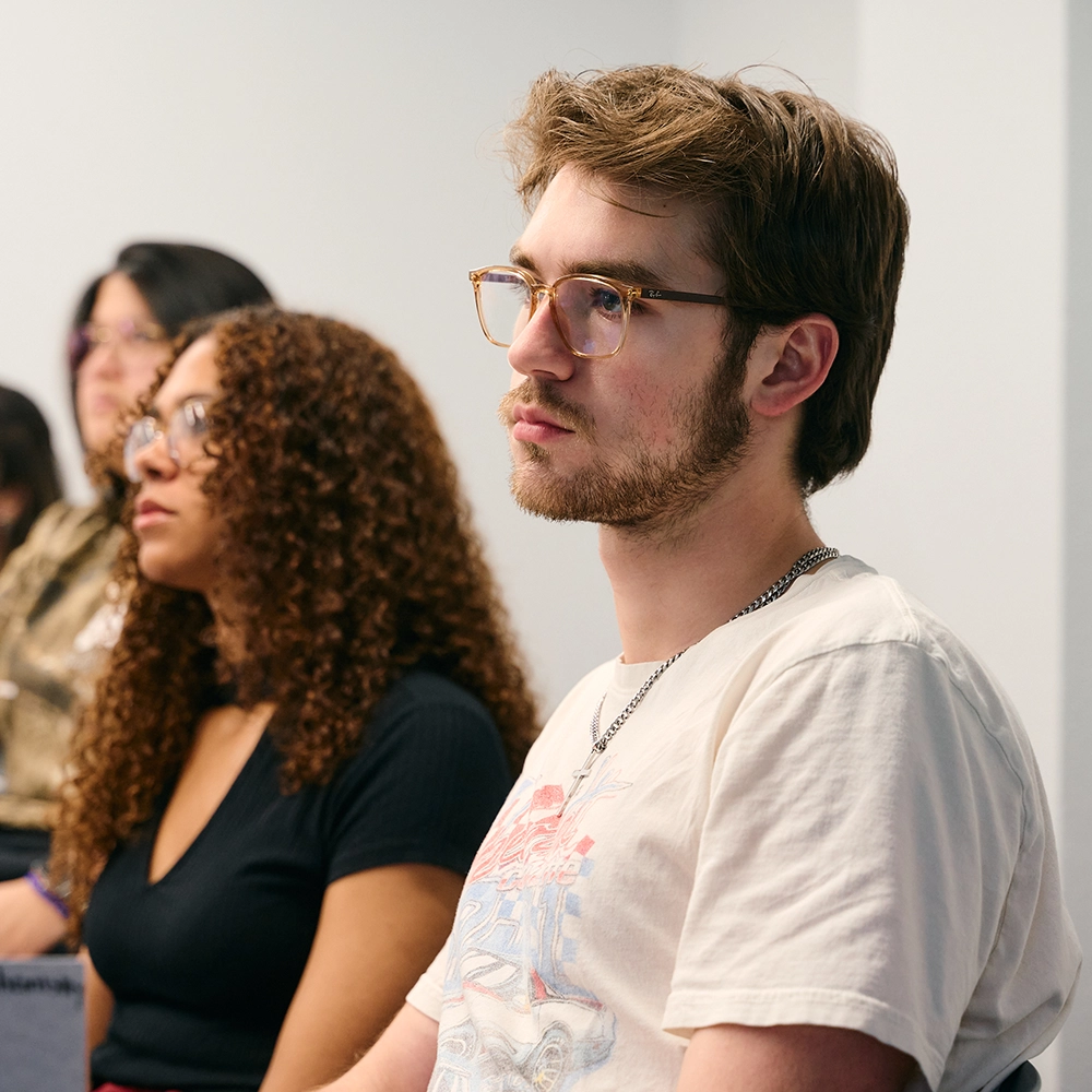 Students in classroom listening to speaker​ 