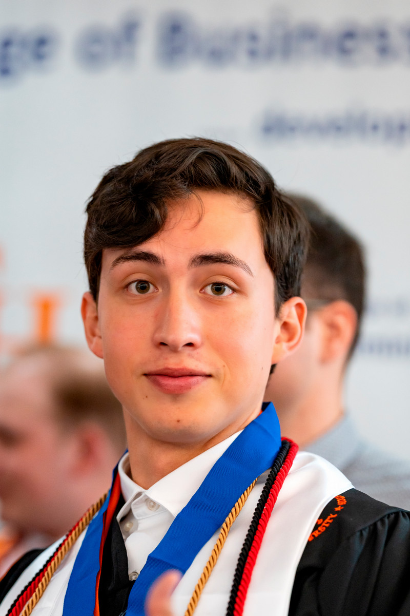 Man in suit talking to another man