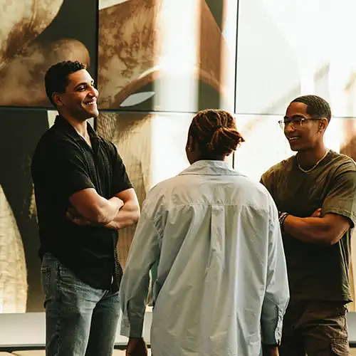 SHSU students talking with each other. 