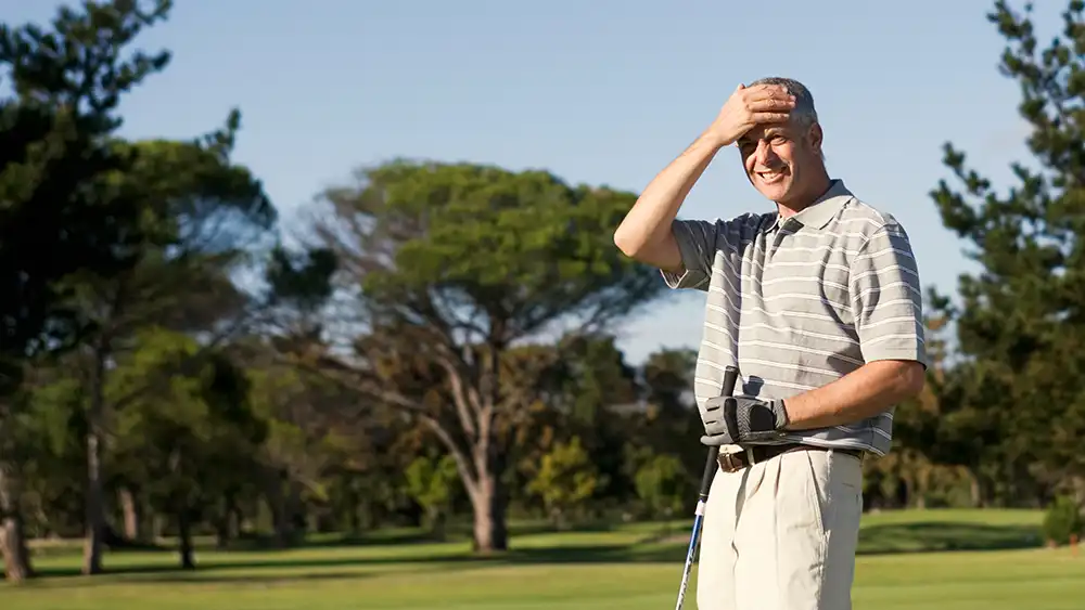 Professor speaking to the camera in a classroom style class, with her hands opened.