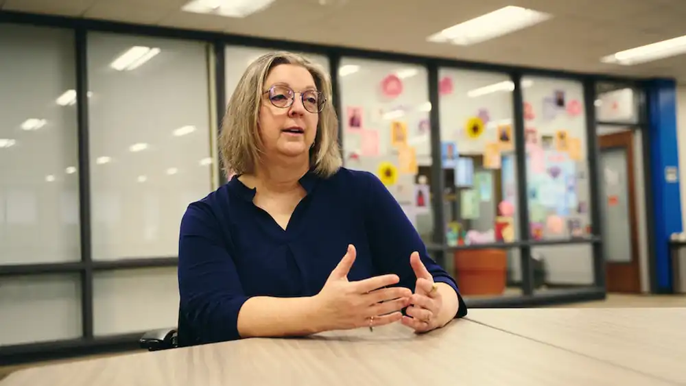Professor speaking also with her hands