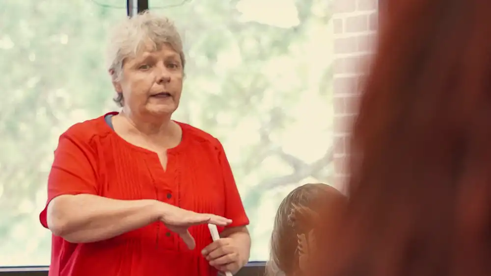 Female professor lecturing a class