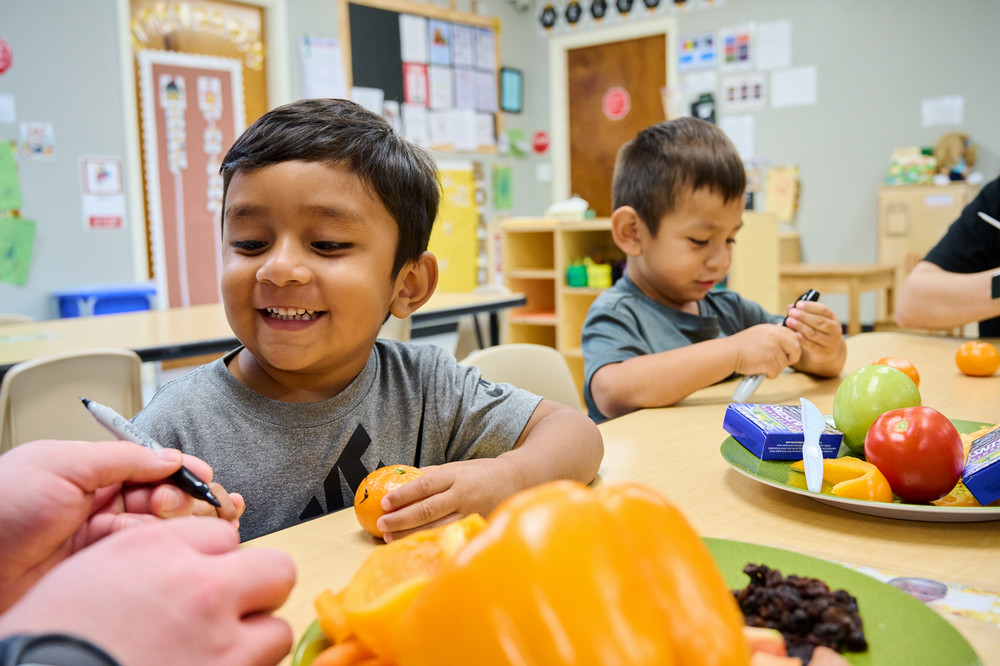 Man in suit talking to another man