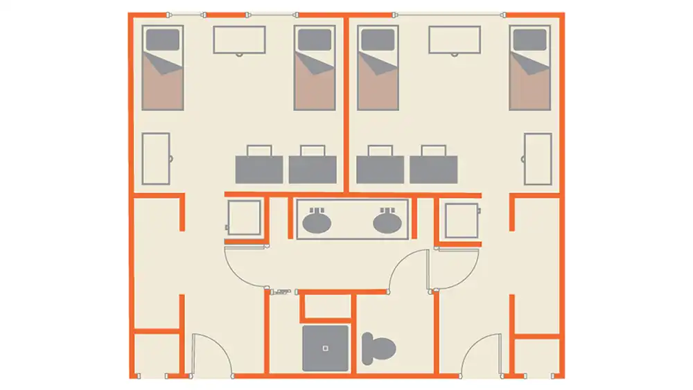 Floor plan of the San Jacinto Hall suite-style unit at Sam Houston State University. One bedroom is located on the left and one on the right, each furnished with two beds and desks. The center of the layout features the “Jack-and-Jill” bathroom. A walkway beneath the sinks leads to two separate areas—one with a toilet and, the other with a shower stall. Doors at both ends of the bathroom provide access to each side of the suite. 