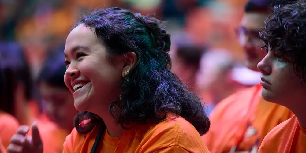 Girl smiling at presenter