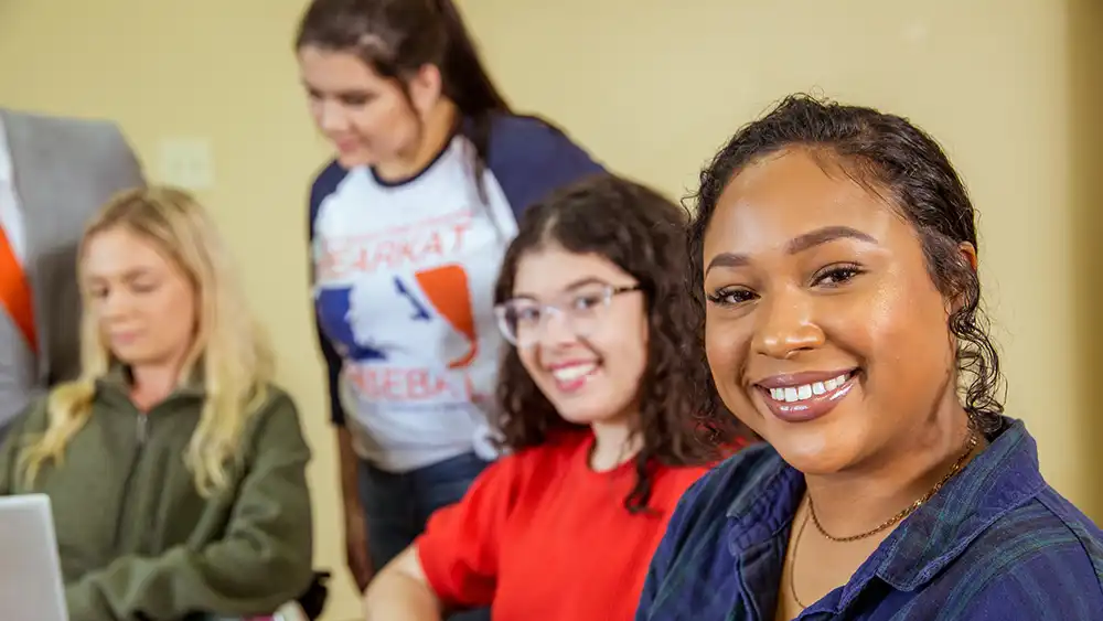 Four students together inside.