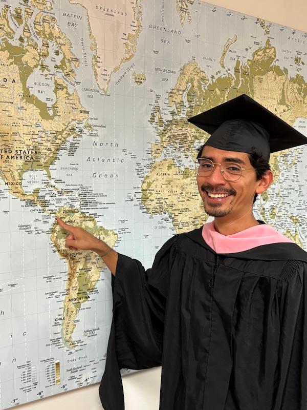 grad student points to map