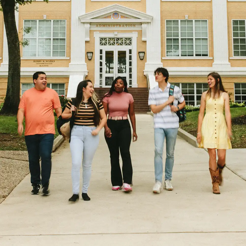 ​​Student walking hand-in-hand​ 