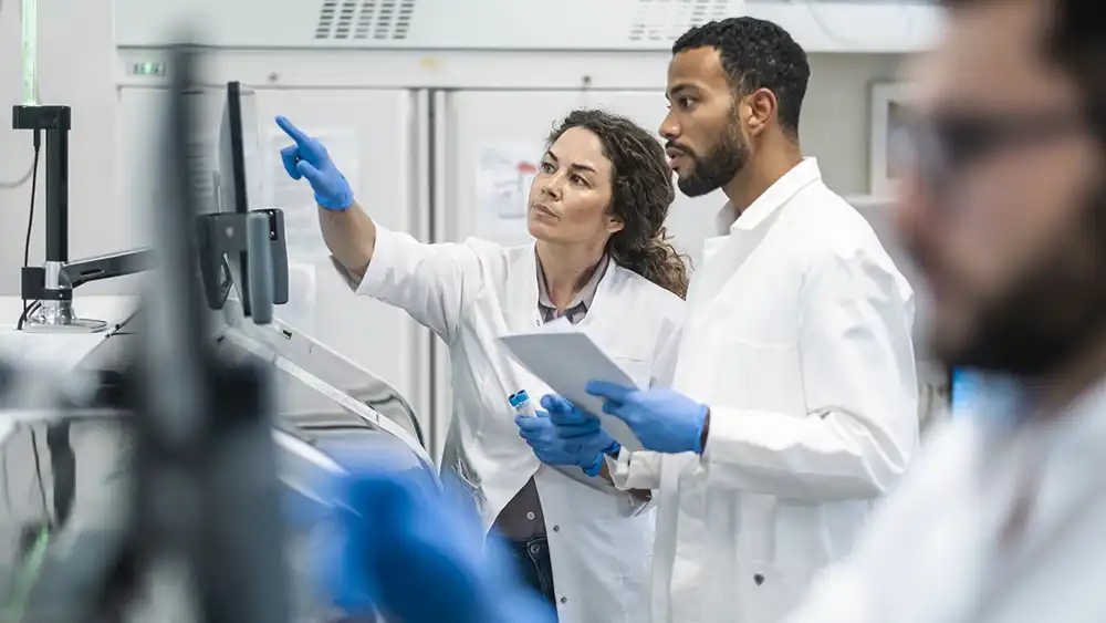 Man and woman in laboratory. 