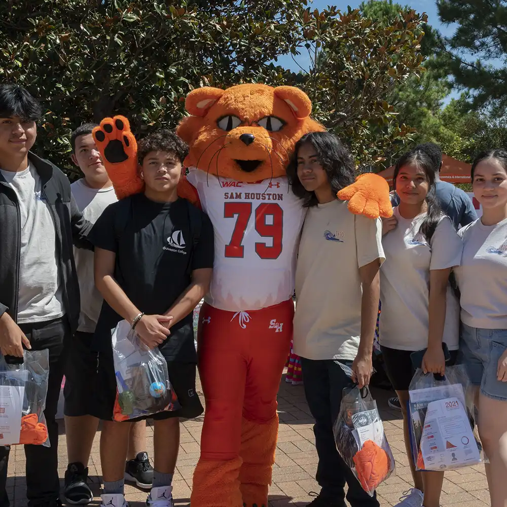 A group of students standing with Sammy