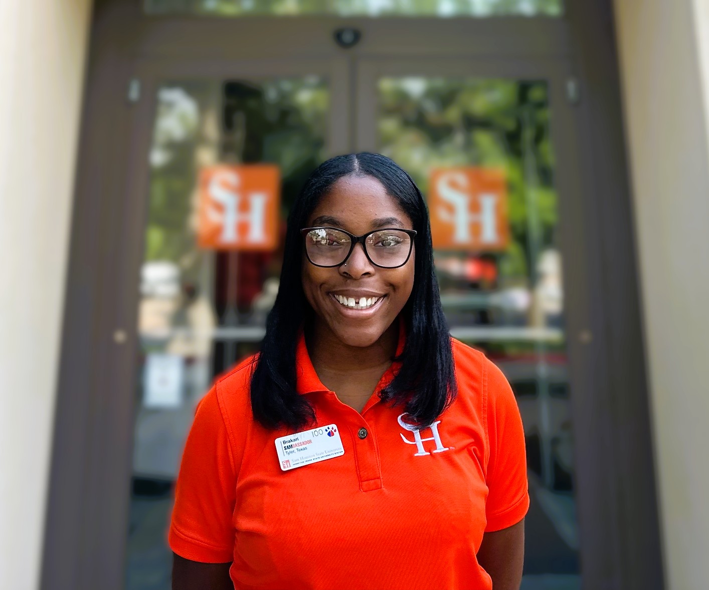 Photo of Brakari Granberry-Session in front of the Sam Houston State University Visitor Center. 